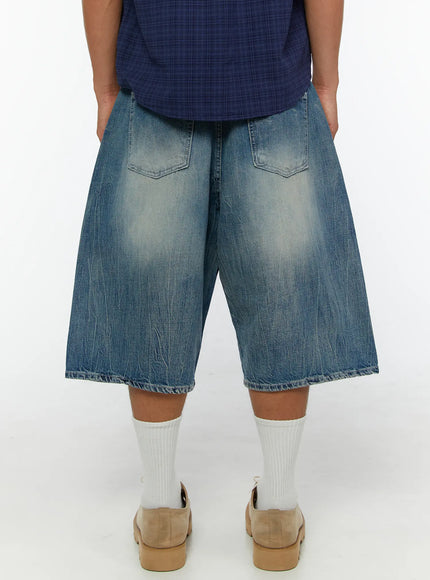 Men's Washed Wide Leg Jorts IL513 Blue back close-up on model showing dual back pockets with arc stitching and overall vintage faded denim wash texture