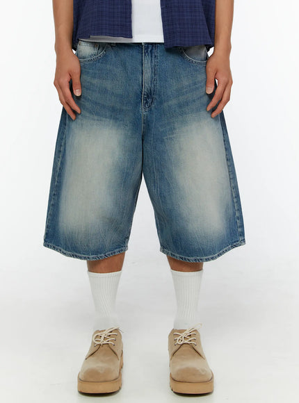 LEWKIN Men's Washed Wide Leg Jorts IL513 Blue front close-up on model showing faded denim texture, wide leg silhouette, and waistband detail styled with white socks and beige shoes
