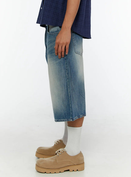 Men's Washed Wide Leg Jorts IL513 Blue side full-body shot on model showing silhouette profile, wide leg shape, sun-faded denim texture, and hem stitching detail