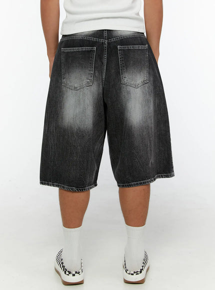 Men's Washed Wide Leg Jorts IL515 Black back shot on model showing dual patch pockets, heavy fade wash, and wide-leg cut with raw hem