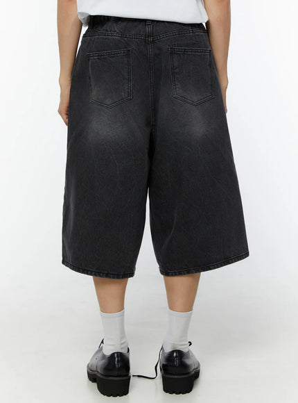 Men's Washed Wide Leg Jorts IU529 dark gray back view on model showing dual back pockets and washed faded denim texture with black oxford shoes
