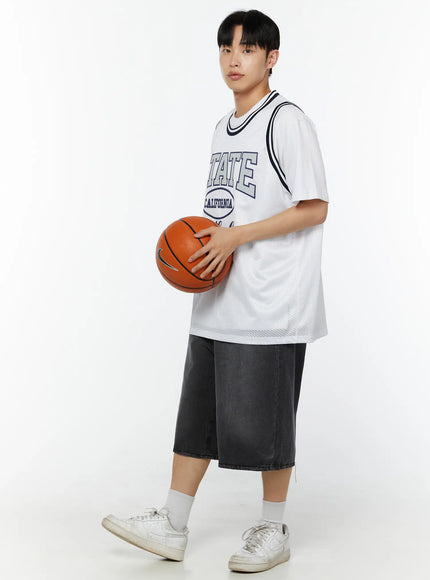 Men's Washed Wide Leg Jorts IU529 dark gray angled full-body on male model holding basketball sideways, white jersey styling with white sneakers