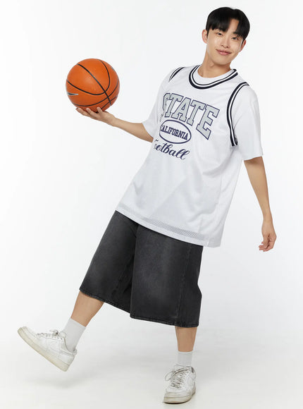 Men's Washed Wide Leg Jorts IU529 dark gray full-body on male model smiling holding basketball overhead, white jersey and sneakers, active pose