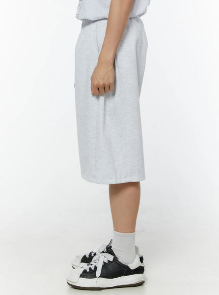 Men's Wide Leg Bermuda Sweat Shorts (Light Gray) IU529 Light Gray side view on model showing knee-length hem, side seam detail and relaxed wide-leg drape