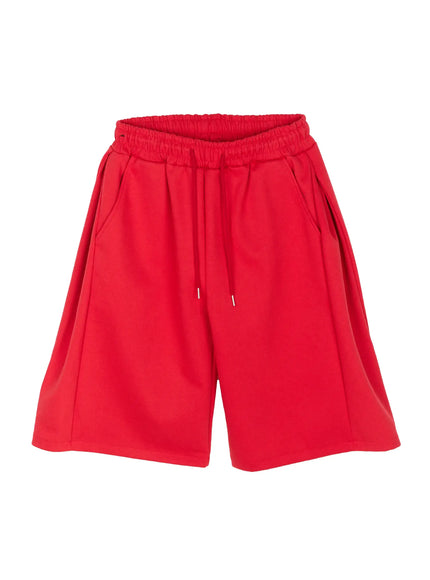 Men's Wide Leg Bermuda Sweat Shorts (Red) IU529 Red flat-lay front view showing full silhouette, elastic ruched waistband, drawstring with silver aglets, and wide-leg bermuda length