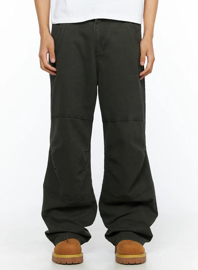 LEWKIN Men's Wide Leg Cargo Pants IL528 dark olive front close-up on model showing panel stitching and wide-leg silhouette with tan boots