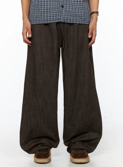 LEWKIN Men's Wide Leg Cotton Pants IL528 Dark brown front close-up on model showing drawstring waistband and wide-leg silhouette with linen-texture fabric