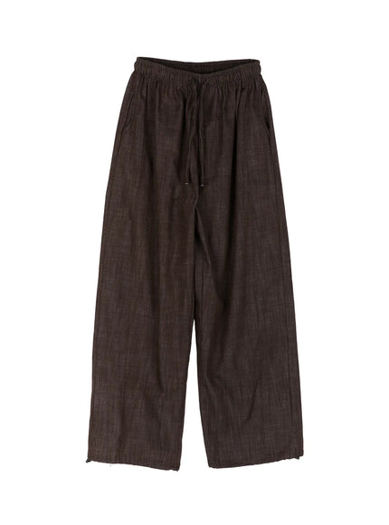 Men's Wide Leg Cotton Pants IL528 Dark brown flat-lay front view showing elastic drawstring waistband wide-leg cut and raw hem edge on white background