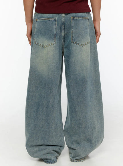 Men's Wide Leg Jeans IL510 light blue back shot on male model showing dual back pockets contrast stitching and faded wash wide leg denim