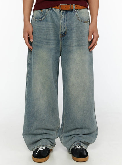 LEWKIN Men's Wide Leg Jeans IL510 light blue front close-up on male model wearing brown belt and dark sneakers showing washed denim texture