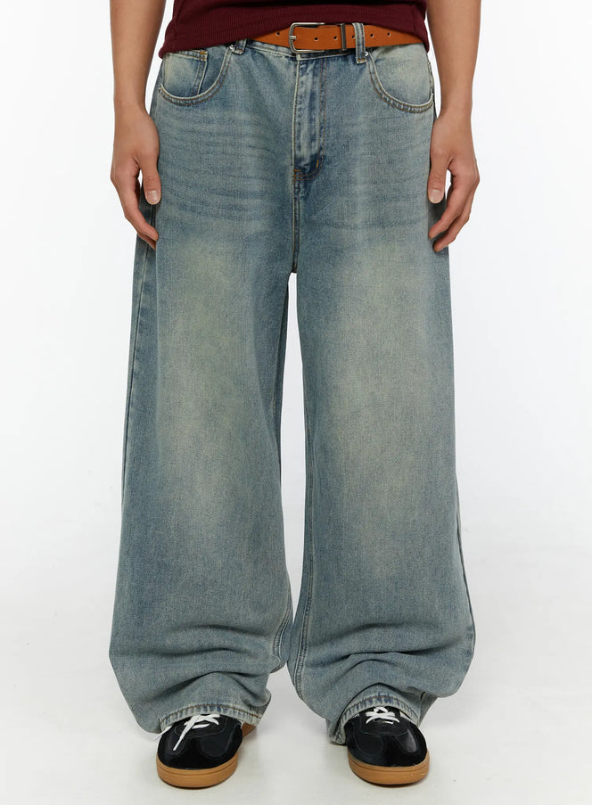 LEWKIN Men's Wide Leg Jeans IL510 light blue front close-up on male model wearing brown belt and dark sneakers showing washed denim texture