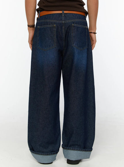 Men's Wide Leg Jeans IL515 dark blue back view on male model showing dual back pockets stitching detail and rolled cuff hem with tan belt