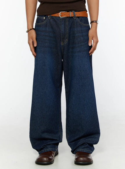 LEWKIN Men's Wide Leg Jeans IL515 dark blue front view on male model wearing brown top and tan leather belt with brown loafers
