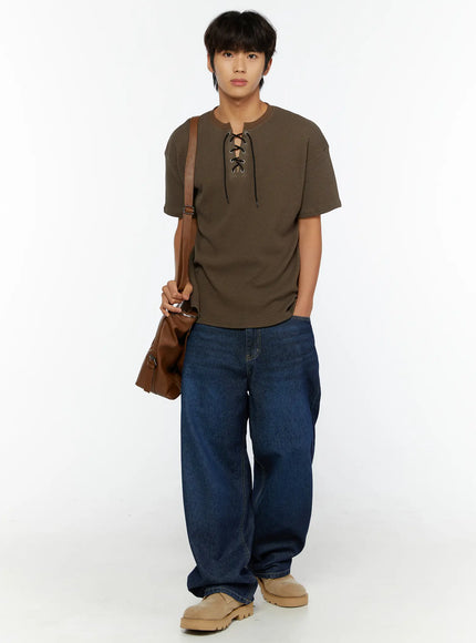 Men's Wide Leg Jeans IL515 dark blue full-body front view on male model styled with waffle-knit lace-up tee and brown crossbody bag