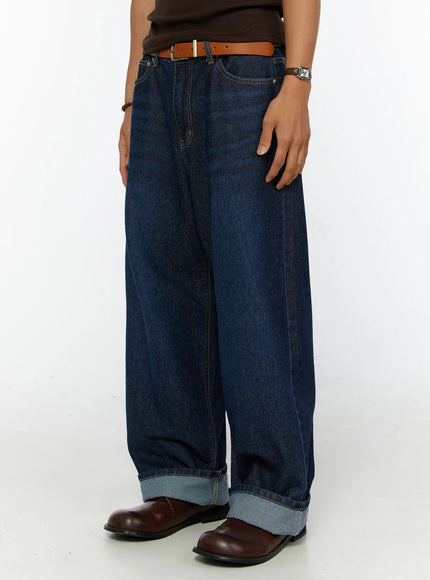 Men's Wide Leg Jeans IL515 dark blue side-angle close-up on model showing rolled cuff hem detail and wide-leg denim silhouette