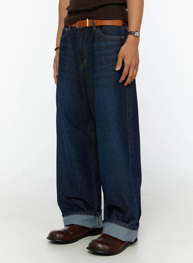 Men's Wide Leg Jeans IL515 dark blue side-angle close-up on model showing rolled cuff hem detail and wide-leg denim silhouette