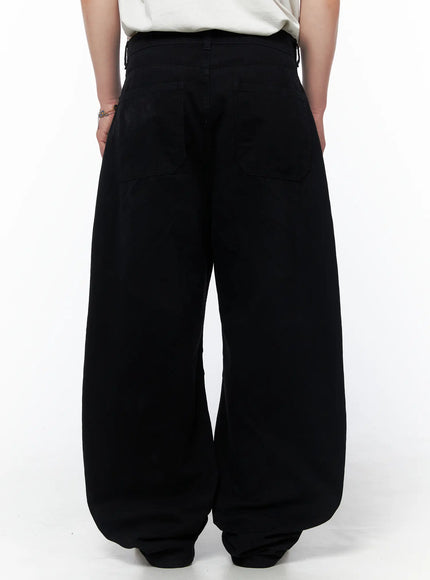 Men's Wide Leg Pants IU523 Black back view on model showing two large patch pockets wide leg hem bunching and drawstring waistband detail