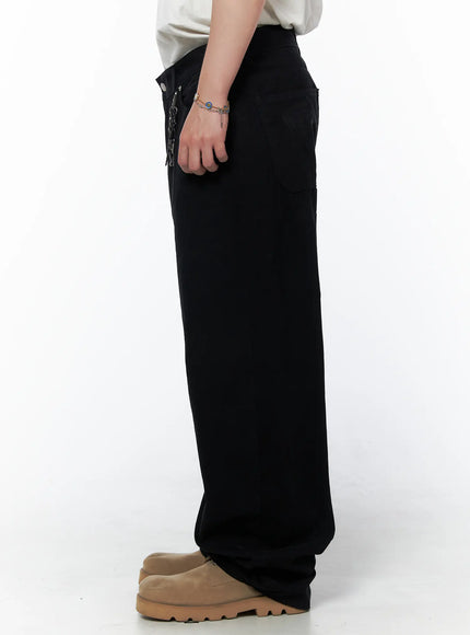 Men's Wide Leg Pants IU523 Black true side view on model showing streamlined profile wide leg drop and full length to ankle