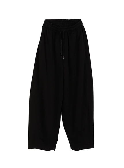 Men's Wide Leg Sweatpants (Black) IL514 black flat-lay front view showing full silhouette, elastic drawstring waist, wide ballooned legs, and clean minimal jersey fabric