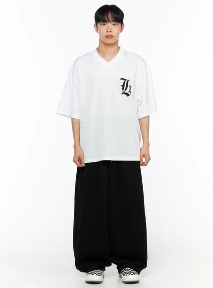 Men's Wide Leg Sweatpants (Black) IL514 black full-body front view on male model wearing white V-neck tee, standing straight, showing extreme wide-leg drop and elastic waist