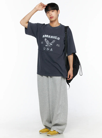Men's Wide Leg Sweatpants IL510 Gray full-body front shot on model styled with charcoal America USA graphic oversized tee and black crossbody bag