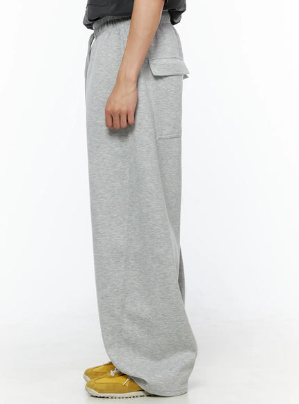 Men's Wide Leg Sweatpants IL510 Gray close-up back detail shot on model showing dual flap back pockets and elastic waistband texture