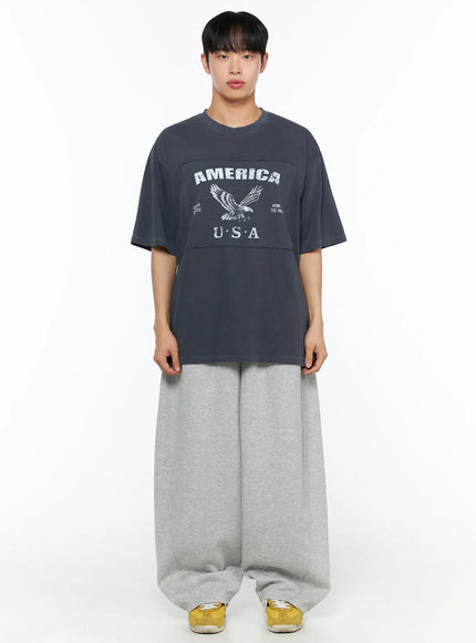 Men's Wide Leg Sweatpants IL510 Gray front shot on model showing full-length balloon wide leg silhouette with drawstring waist and yellow sneakers