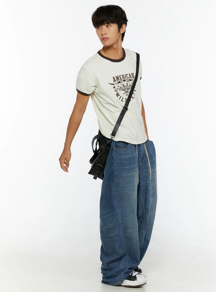 Men's Wide Leg Tie-Detail Jeans IL513 Blue full-body angled shot on male model looking aside styled with graphic tee and black crossbody bag