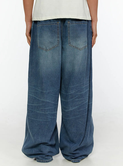 Men's Wide Leg Tie-Detail Jeans IL513 Blue back shot on model showing dual back pockets elastic waistband and washed whisker detailing with pooled hem