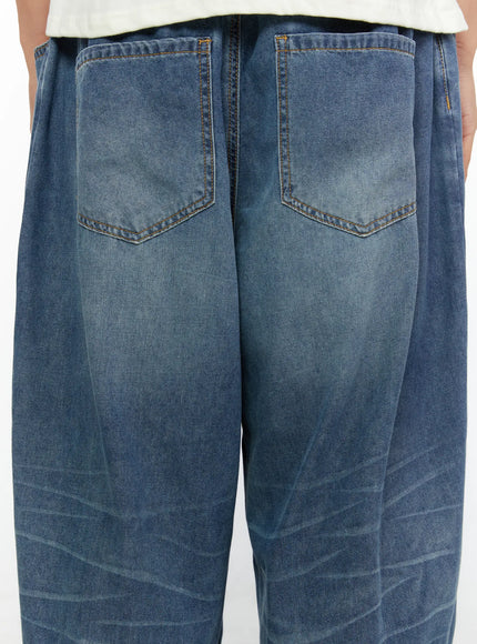 Men's Wide Leg Tie-Detail Jeans IL513 Blue close-up back detail showing two washed denim back pockets with orange stitching and faded finish