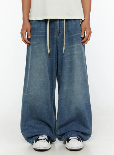 LEWKIN Men's Wide Leg Tie-Detail Jeans IL513 Blue front crop shot on model showing drawstring waist and ultra-wide washed denim legs size M/L