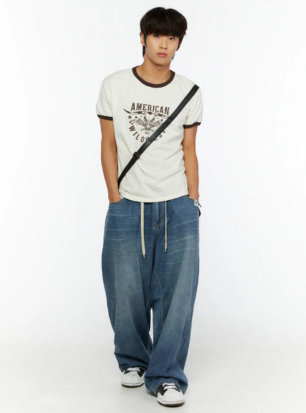 Men's Wide Leg Tie-Detail Jeans IL513 Blue full-body front shot on male model styled with graphic tee and crossbody bag standing straight
