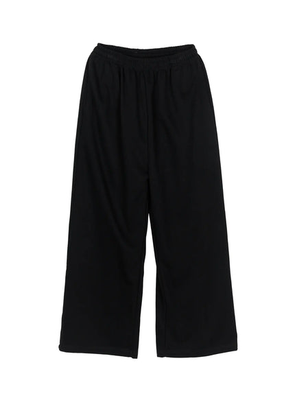 Men's Wide Sweatpants (Black) IL507 Black flat-lay front view showing elastic waistband, wide-leg cut and smooth fabric texture