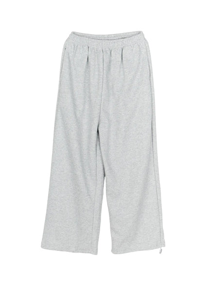 Men's Wide Sweatpants (Gray) IL507 Gray flat-lay front view showing elastic waistband pintuck crease wide-leg cut and side zipper hem detail in heathered gray fleece fabric