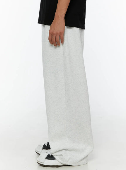 Men's Wide Sweatpants (Light Gray) IL507 Light gray side shot on model showing straight wide-leg silhouette with center crease and pooled hem detail