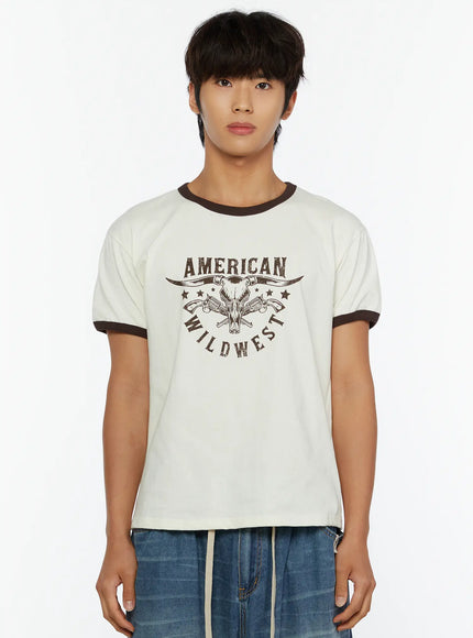 Men's Wild West Graphic T-Shirt IL513 Brown front close-up on male model showing full American Wild West bull skull graphic and brown ringer trim