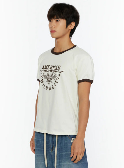 Men's Wild West Graphic T-Shirt IL513 Brown side view cropped waist on male model showing dark brown ringer sleeve cuffs and collar detail