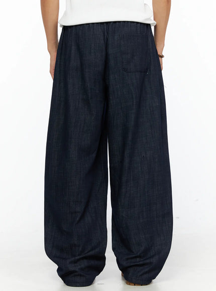 Men's Zack Wide Leg Jeans IL528 Dark blue back view on model showing single back pocket detail, elastic waistband, and voluminous wide-leg denim shape