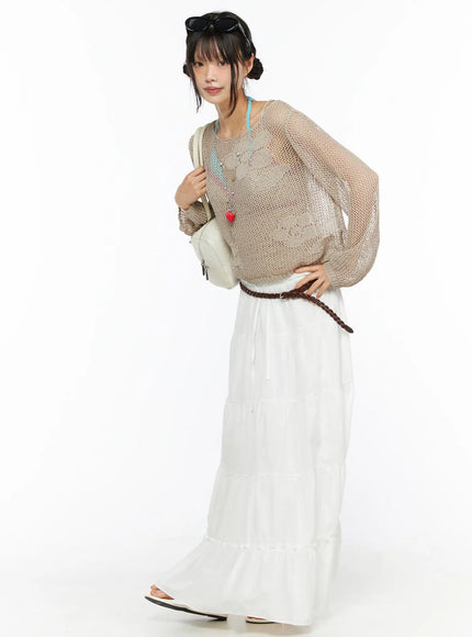 Mesh Knit Sweater CU530 Beige three-quarter side view on model styled with white maxi skirt white bag strawberry necklace and sunglasses sheer open-knit