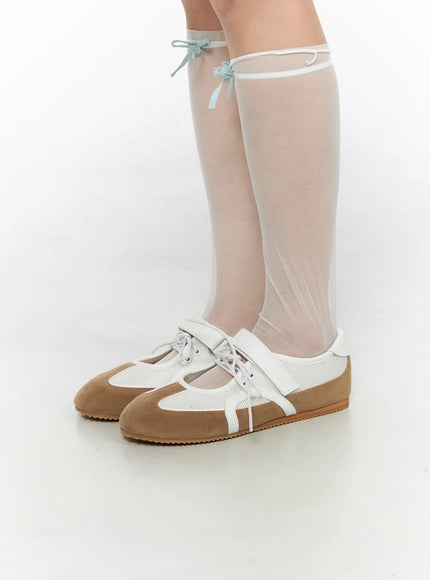 Mesh Mary Jane Sneakers CL517 Beige front-facing close-up on standing model with sheer knee-high socks, highlighting beige suede toe, mesh upper and white strap