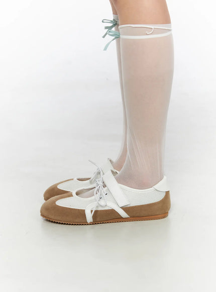 Mesh Mary Jane Sneakers CL517 Beige side close-up on model wearing sheer knee-high socks, showing lateral profile with beige suede, mesh panel and white rubber sole