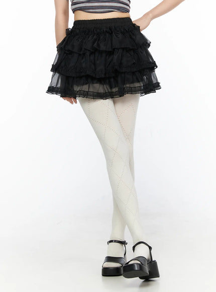 LEWKIN Mesh Tiered Mini Skirt CL522 Black S/M close-up front view on model showing layered ruffle organza mini skirt with elastic waistband and lace trim hem