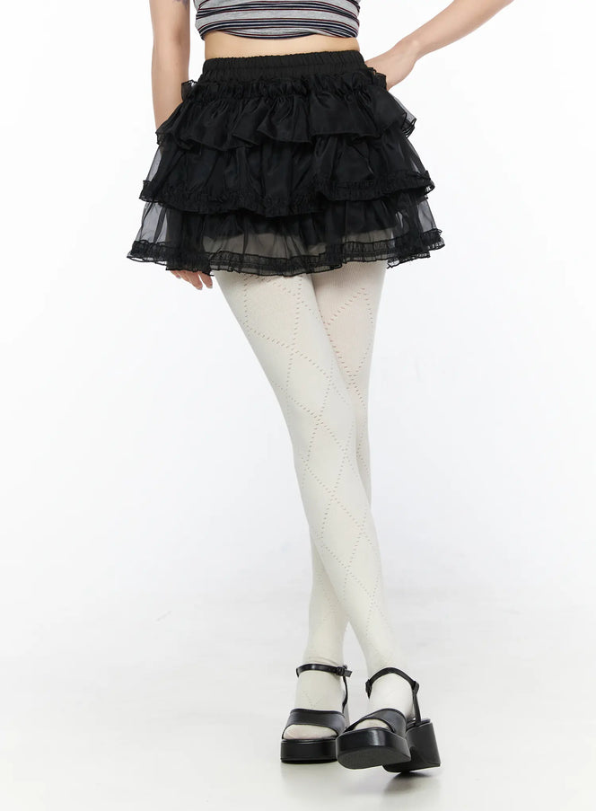 LEWKIN Mesh Tiered Mini Skirt CL522 Black S/M close-up front view on model showing layered ruffle organza mini skirt with elastic waistband and lace trim hem