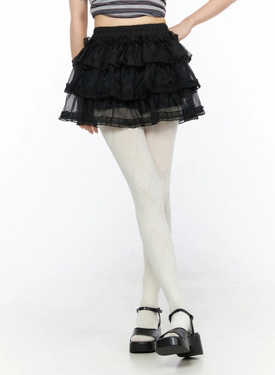 LEWKIN Mesh Tiered Mini Skirt CL522 Black S/M close-up front view on model showing layered ruffle organza mini skirt with elastic waistband and lace trim hem