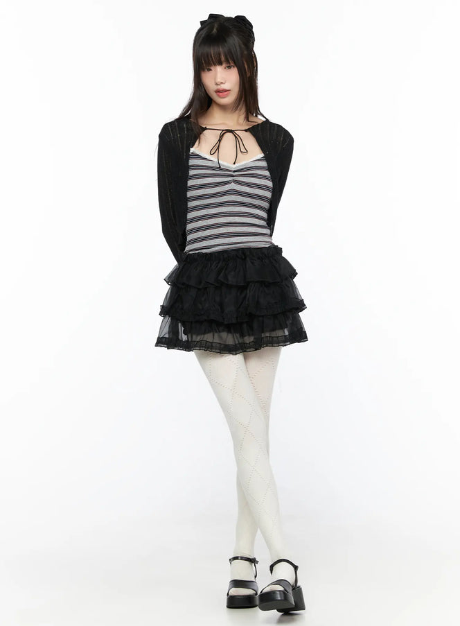 Mesh Tiered Mini Skirt CL522 Black front full-body shot on model styled with striped crop top black cardigan and white diamond-pattern tights