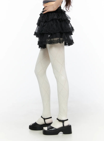 Mesh Tiered Mini Skirt CL522 Black side close-up cropped shot on model highlighting three-tier ruffle layers organza fabric and lace trim detail at hem