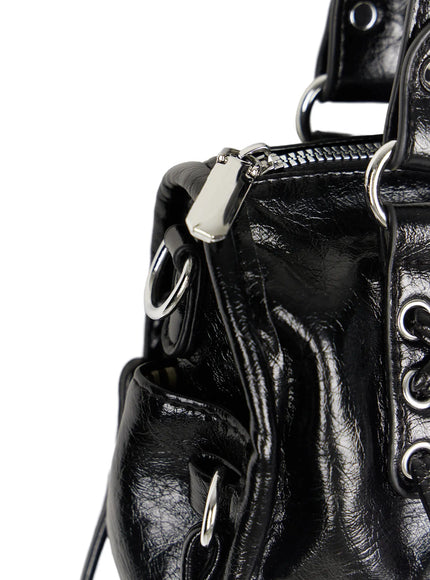 Metallic Detail Shoulder Bag CL508 Black back view product shot on white background showing smooth crinkled faux leather panel double handles and fringe tassel details