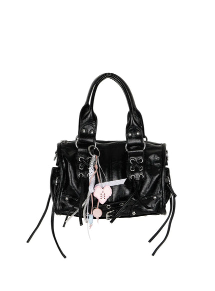 Metallic Detail Shoulder Bag CL508 Black close-up detail of handle strap with silver dome studs ring hardware and cross lace-up eyelet panel on crinkled faux leather