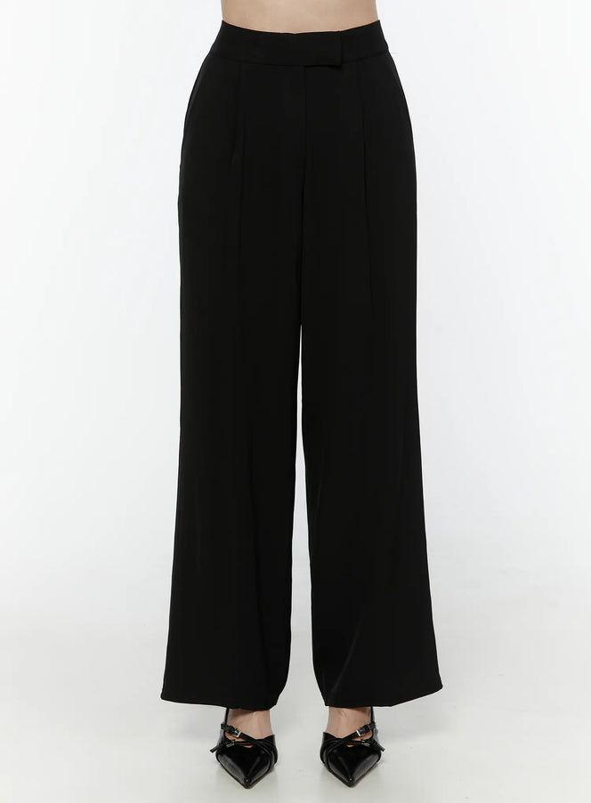 LEWKIN Mid-Rise Tailored Pants IL506 Black Size S front view on model cropped at waist showing high-rise waistband with belt loop tab and wide-leg silhouette paired with black heels