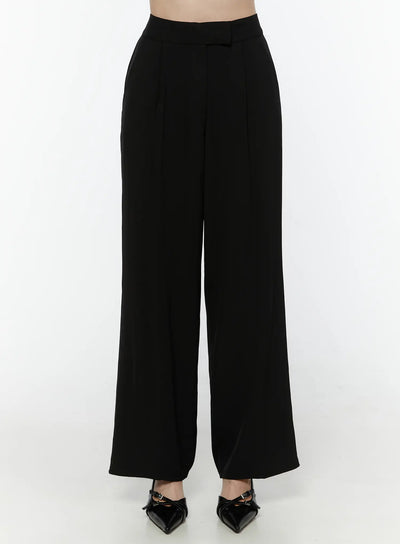 LEWKIN Mid-Rise Tailored Pants IL506 Black Size S front view on model cropped at waist showing high-rise waistband with belt loop tab and wide-leg silhouette paired with black heels